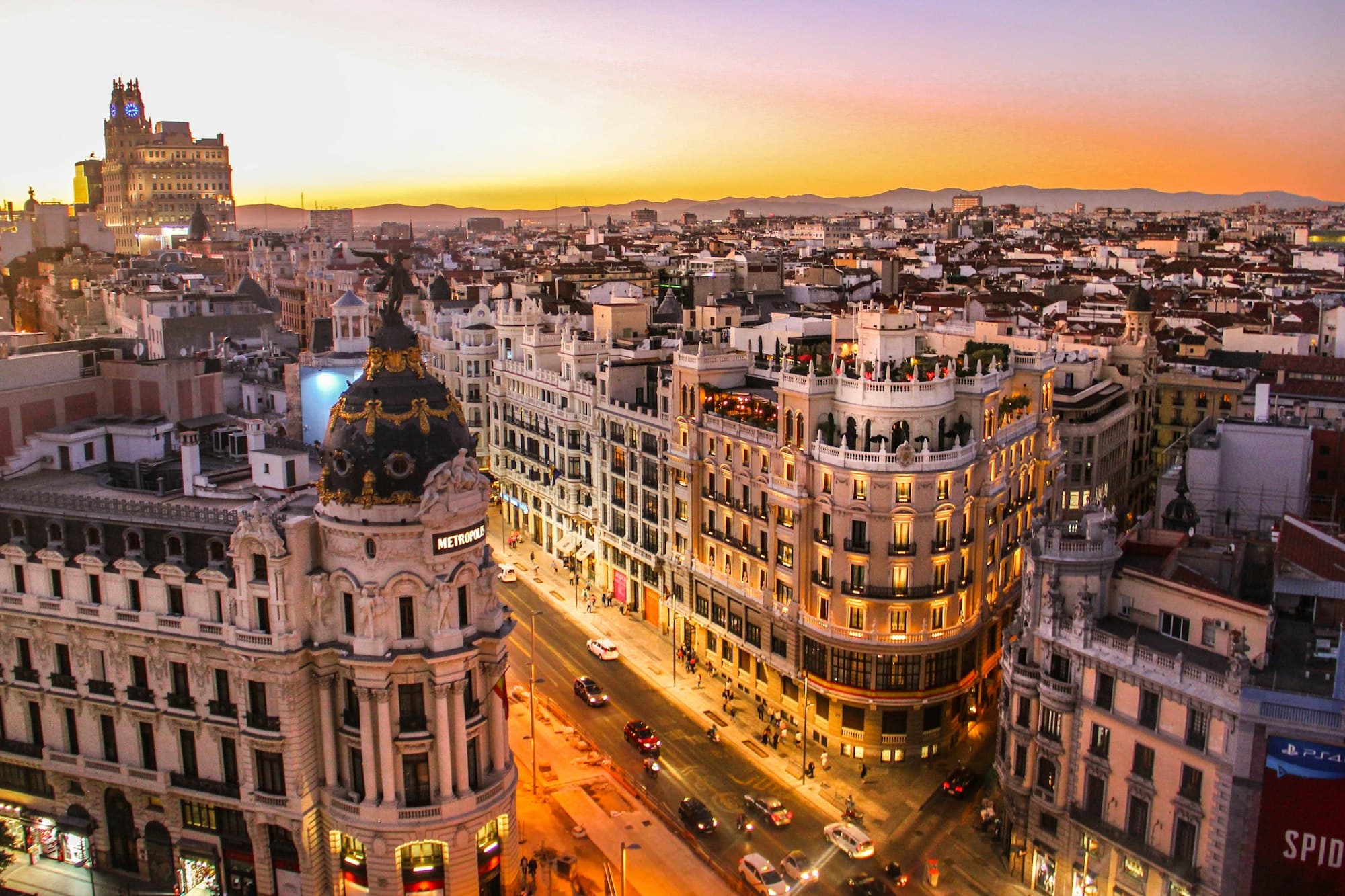 Madrid Gran Via avenue at night lit up with illuminated buildings